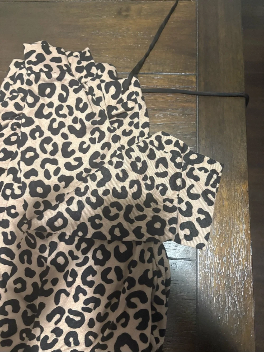Woman Kate Spade Leopard Print pajamas.